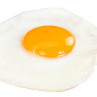 One large, freshly cooked egg with a tender white and a vibrant yolk.