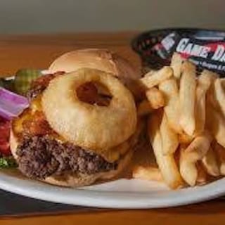 Onion ring, bacon, cheese and BBQ sauce. This item comes with fries.