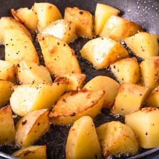 Golden-brown potatoes, seasoned and diced, served as a hearty breakfast side.