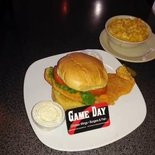 Fish sandwich. Basa or tilapia. Served with lettuce, tomatoes, pickles, onions and fries.