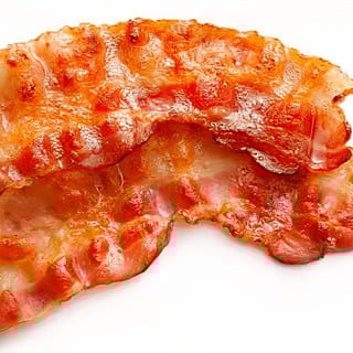 Two crispy bacon strips, golden-brown with a rich, smoky aroma.
