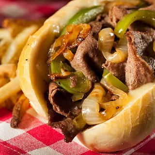 Philly cheese steak or chicken sandwich and fries.