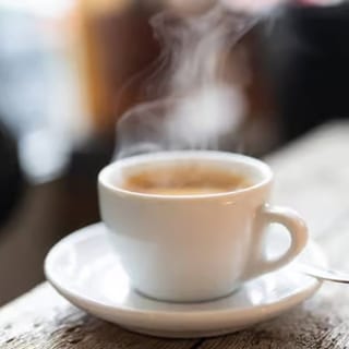 A freshly brewed cup of coffee with a rich aroma