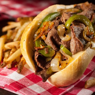 Philly cheese steak or chicken sandwich and fries.