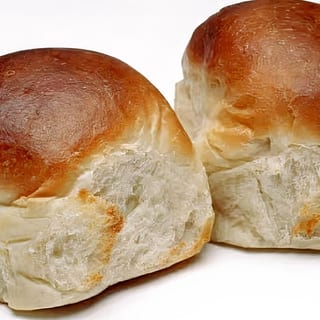 Golden-brown, big biscuits with a soft, flaky texture, ready to be paired with your choice of spread.