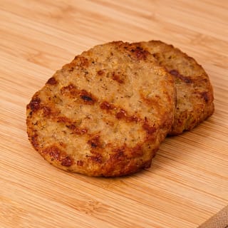Savory pork sausage patties with a hint of herbs, served as a hearty breakfast option.