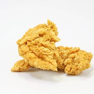 Crispy breaded chicken strips, golden-brown and ready for dipping