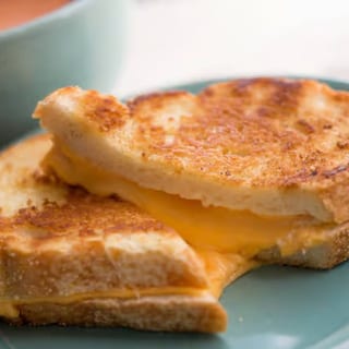 Grilled cheese with a morning twist, served with choice of hash or country potatoes