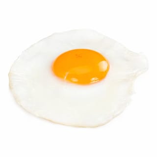 One large, freshly cooked egg with a tender white and a vibrant yolk.